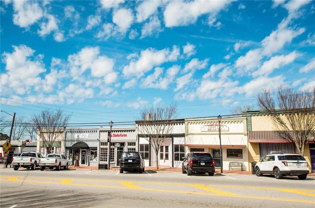 145 South Cherokee Road Social Circle, GA 30025 - Photo 2 of 13 a view of street with parked cars
