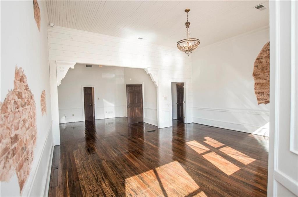 145 South Cherokee Road Social Circle, GA 30025 - Photo 5 of 13 a view of empty room with wooden floor
