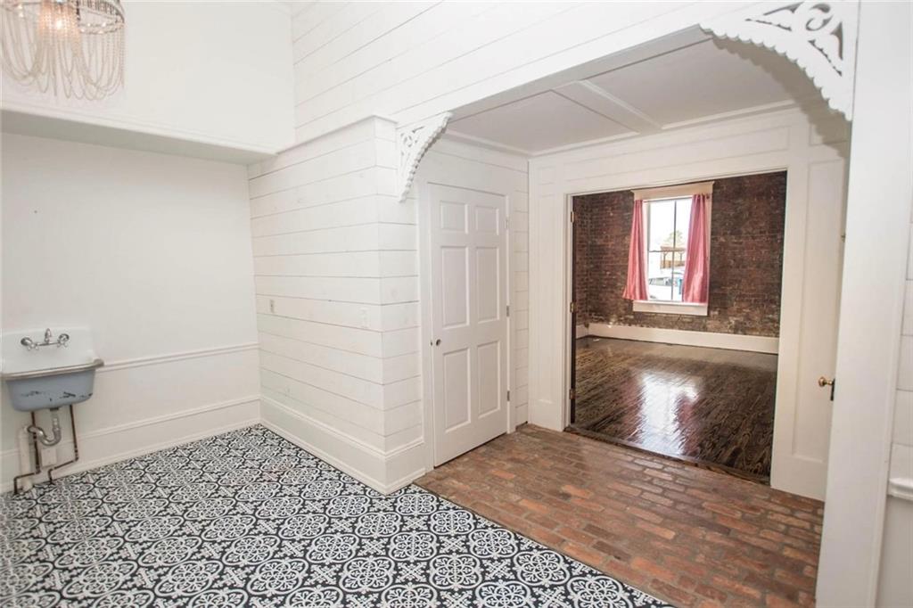 145 South Cherokee Road Social Circle, GA 30025 - Photo 9 of 13 a view of a hallway with wooden floor and a window
