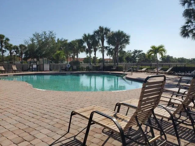 a view of a lake with outdoor seating space