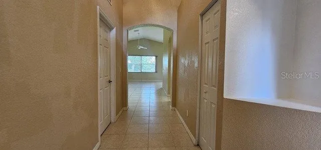 a bathroom with a tub sink shower and mirror