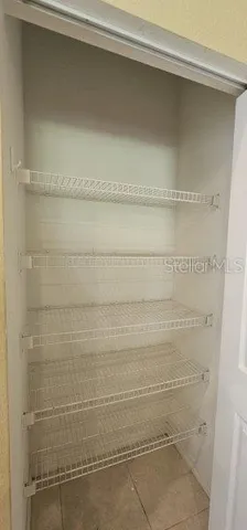 a view of an empty walk in closet