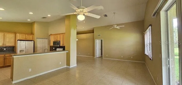 a view of a kitchen with a refrigerator a sink dishwasher and a refrigerator