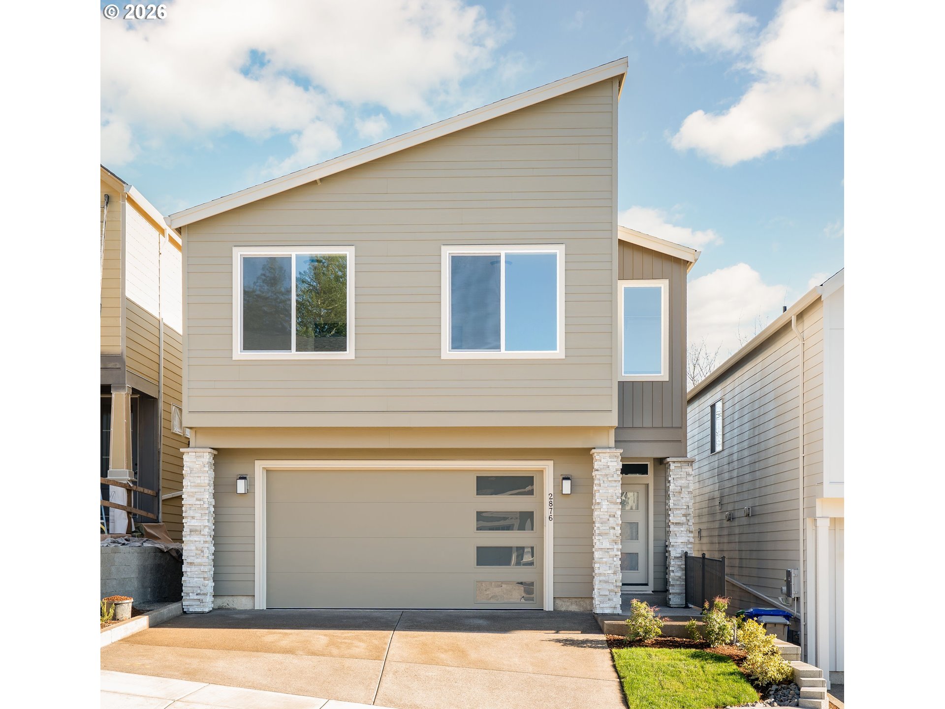 2876 Northwest 114th Terrace Portland, OR 97229 - Photo 1 of 32 a front view of a house with a yard