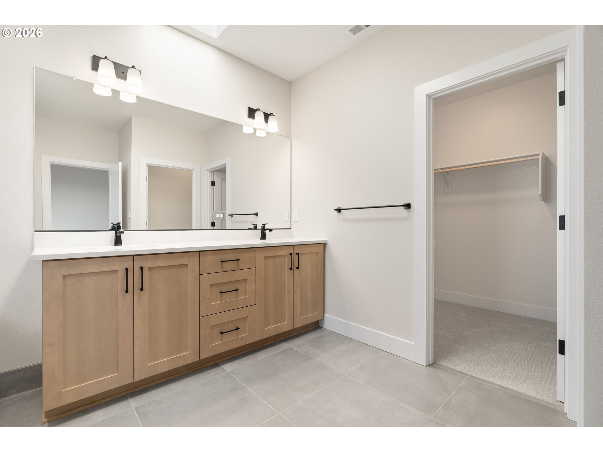 2876 Northwest 114th Terrace Portland, OR 97229 - Photo 21 of 32 a spacious bathroom with a double vanity sink mirror and