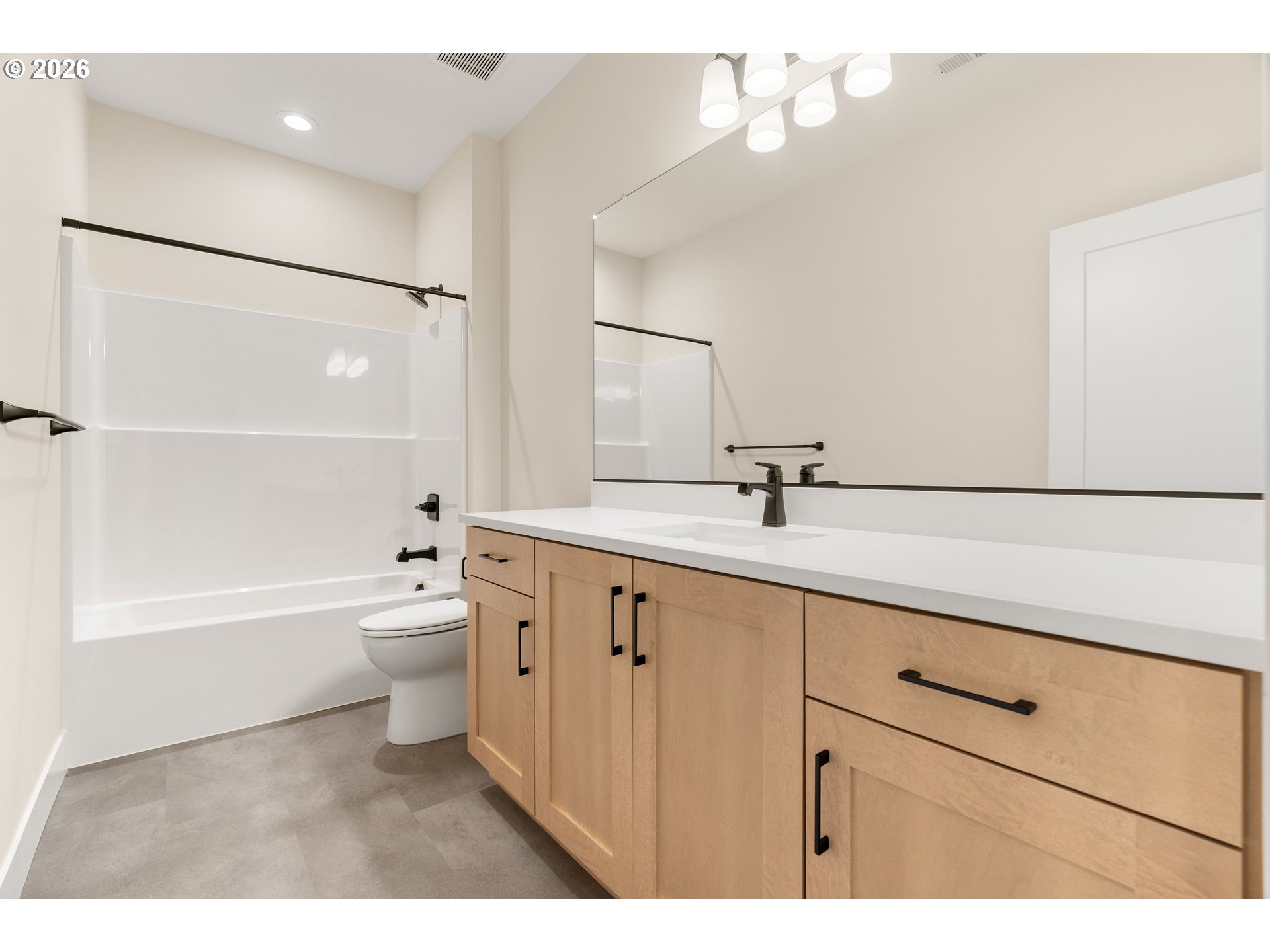 2876 Northwest 114th Terrace Portland, OR 97229 - Photo 24 of 32 a bathroom with a sink a toilet a mirror and bathtub