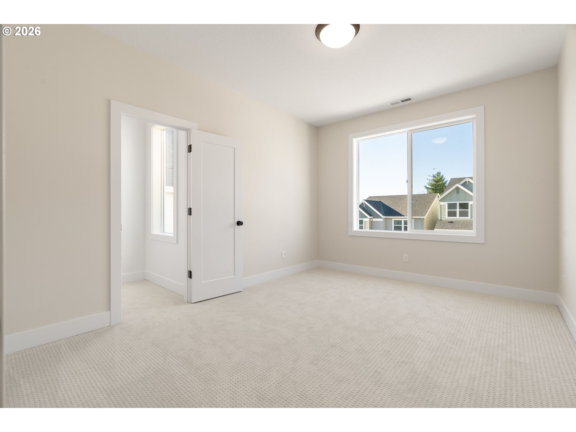 2876 Northwest 114th Terrace Portland, OR 97229 - Photo 27 of 32 a view of an empty room with a window