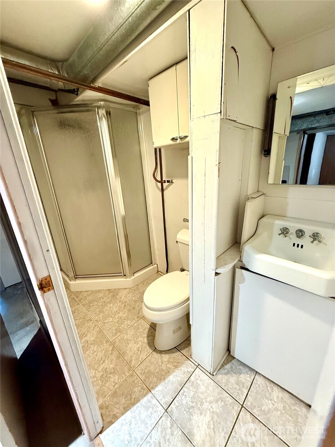 1006 East Dobson Road Odessa, WA 99159 - Photo 28 of 38 a bathroom with a granite countertop sink toilet and shower