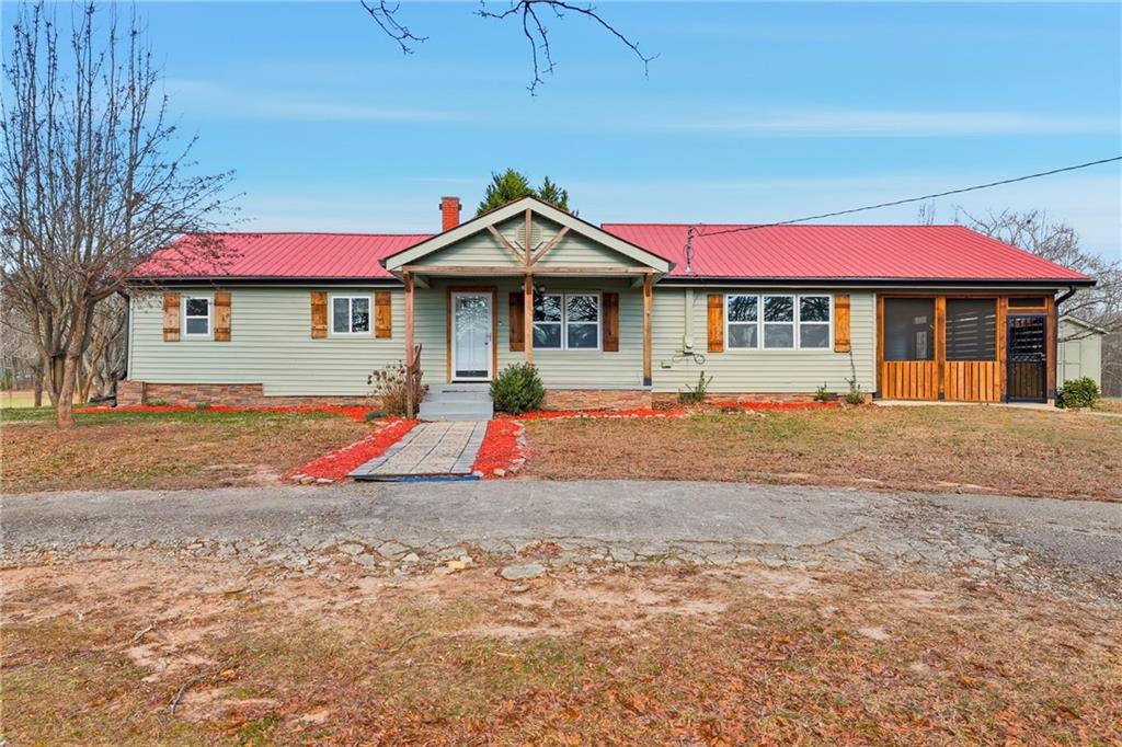 a view of front of house with a yard