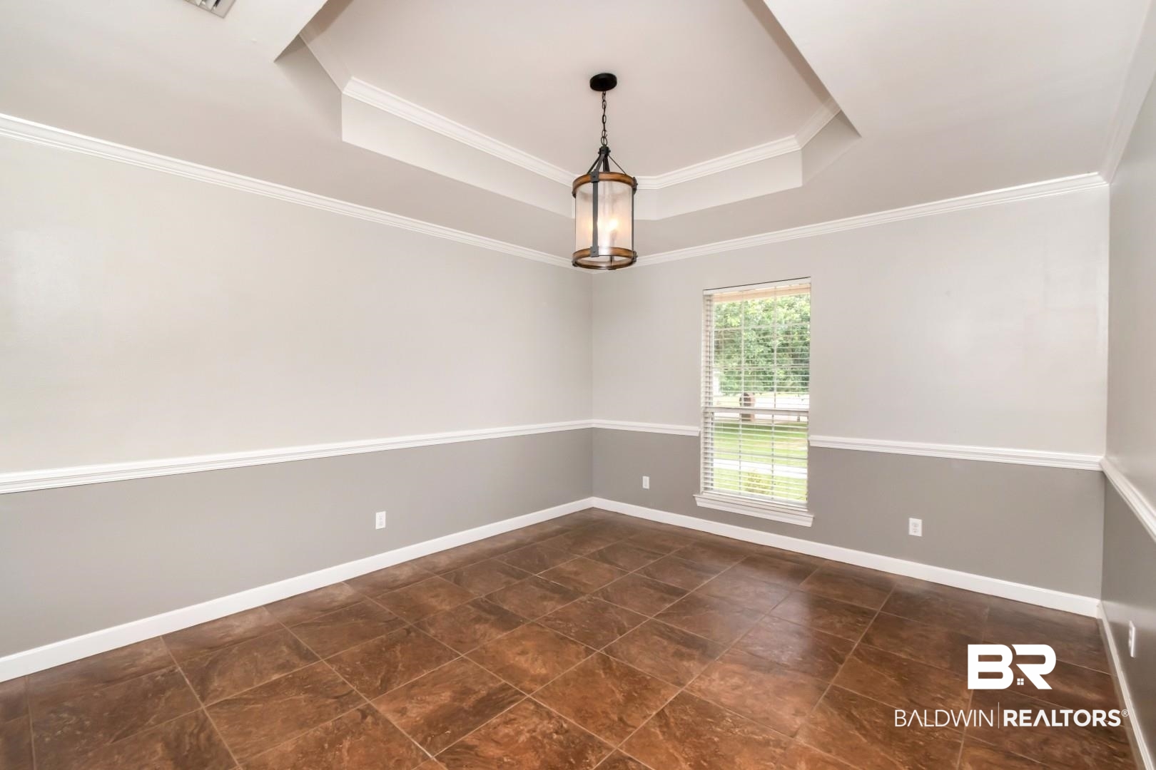 10691 Hunters Ridge Drive Mobile, AL 36695 - Photo 5 of 37 Tray ceiling with crown molding and a hanging lantern-style light fixture
