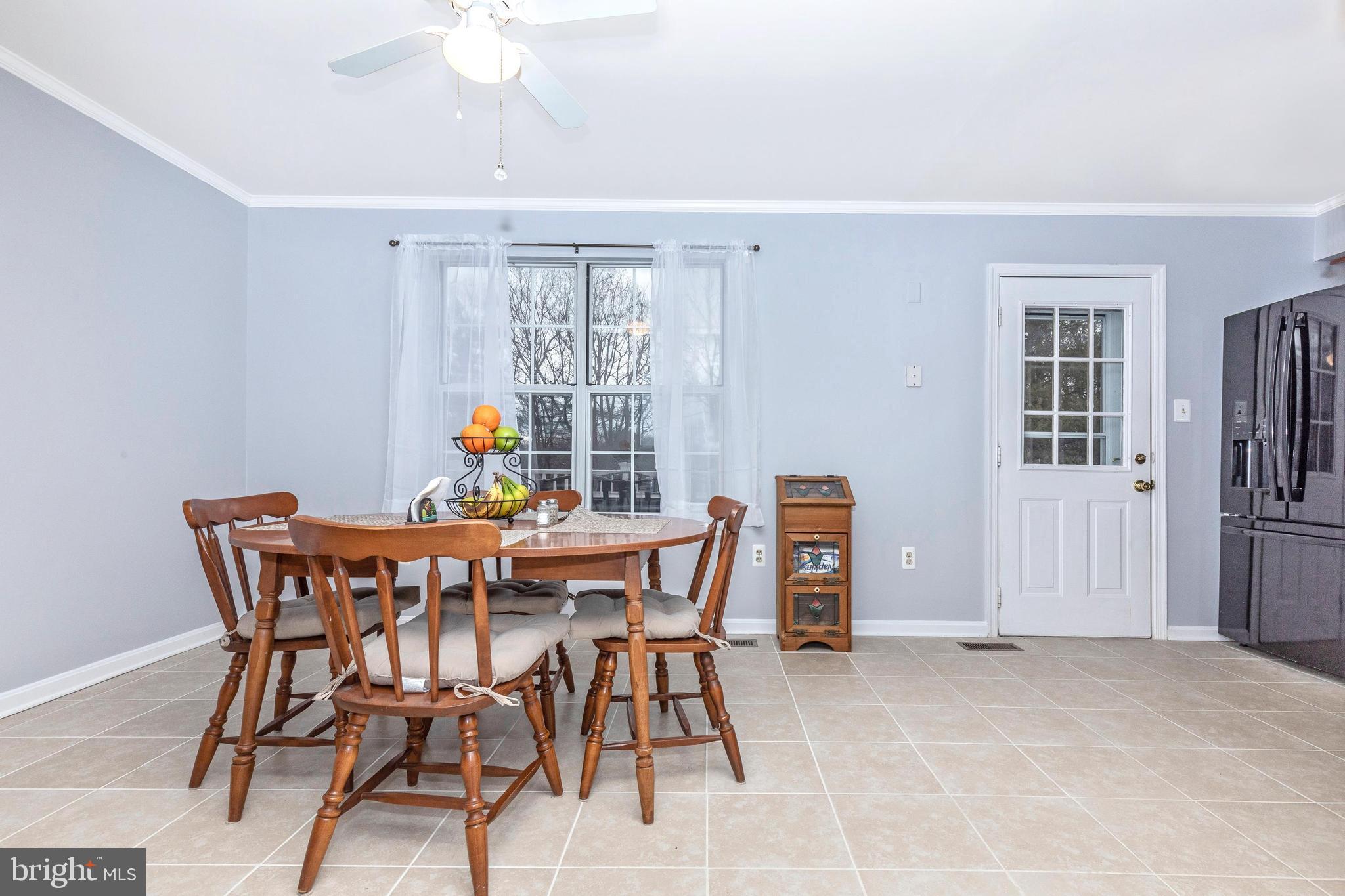 25752 Woodfield Road Damascus, MD 20872 - Photo 15 of 43 Dining room walks out to Trex deck