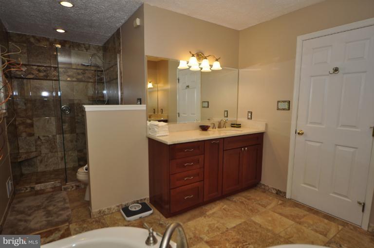 1943 Barton Hill Road Reston, VA 20191 - Photo 15 of 28 a bathroom with a sink double vanity and a mirror