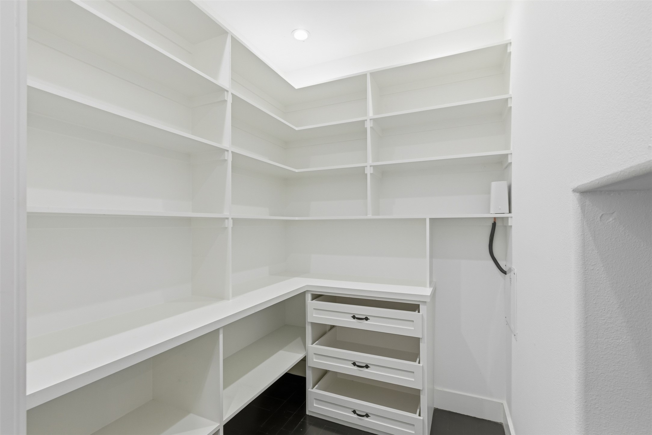 1018 Press Street Houston, TX 77020 - Photo 13 of 31 Spacious walk-in pantry with abundant shelving for optimal kitchen organization.