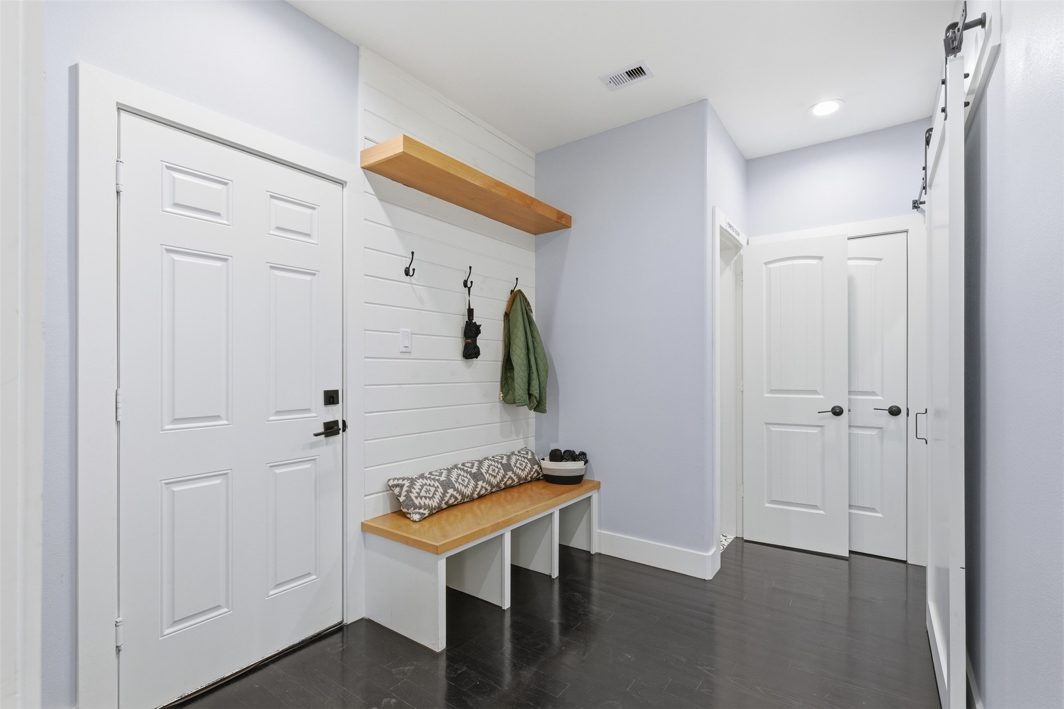 1018 Press Street Houston, TX 77020 - Photo 15 of 31 Functional mudroom with built-in bench, coat hooks, and shoe storage ideal for keeping daily essentials organized.