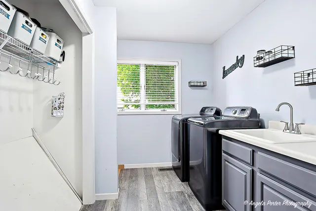 a view of a bathroom with a sink and mirror