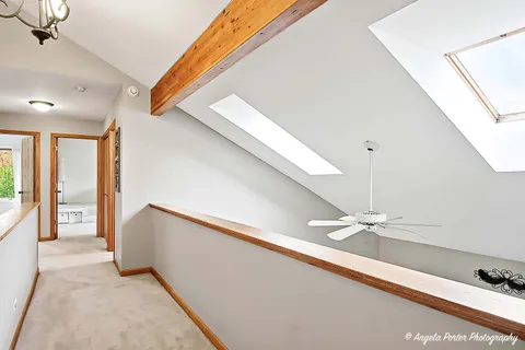 a bedroom with a bed and a night stand