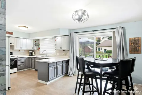 a view of a dining room with furniture window and outside view