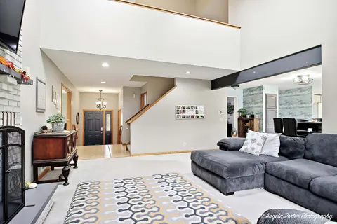 a living room with furniture and a rug
