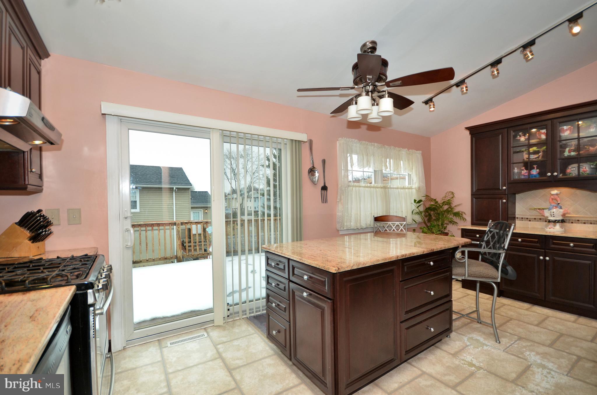 4806 Ebenezer Road Baltimore, MD 21236 - Photo 5 of 30 a kitchen with a stove and a refrigerator
