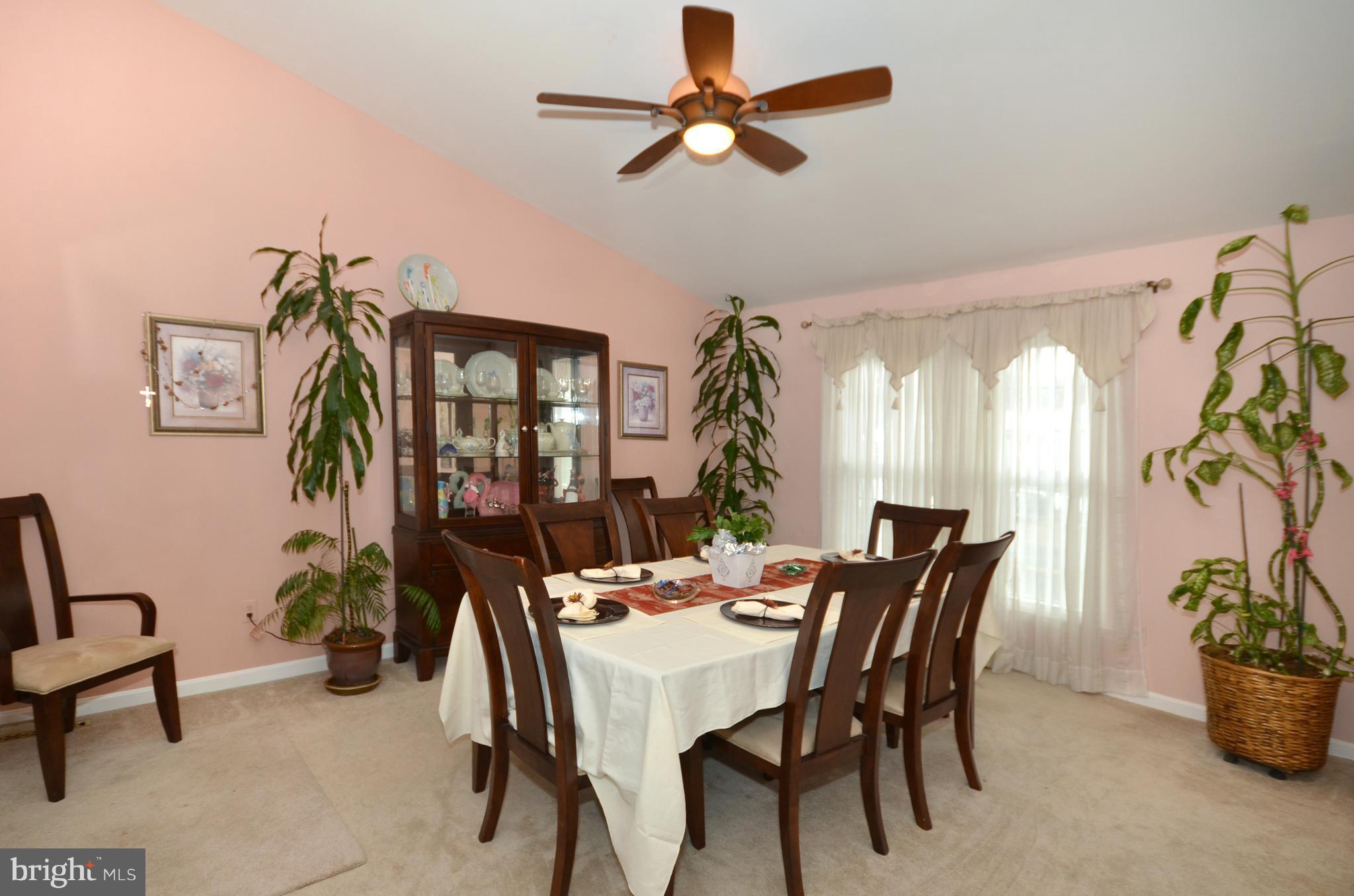 4806 Ebenezer Road Baltimore, MD 21236 - Photo 8 of 30 a dining room with furniture and window