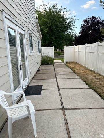 254 Meadow Lane Centerville, UT 84014 - Photo 33 of 34 Private concrete patio accessed via double glass-paned doors