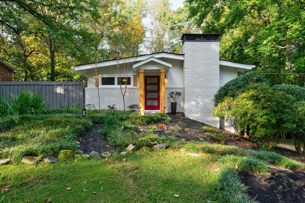 Mid-Century Modern appeal, paired with an amazing location and a pool, is truly a rare find in Brookhavens sought-after Drew Valley. Welcome home!