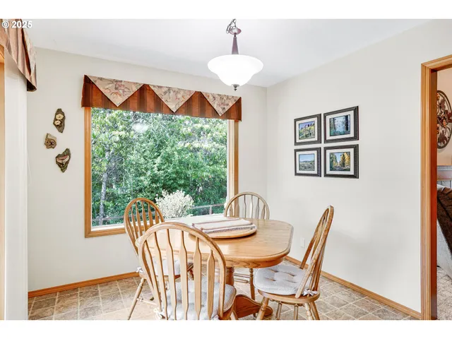 a view of a dining room with furniture window and outside view