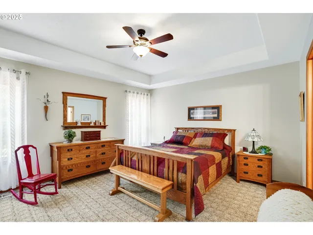 a bedroom with furniture and windows