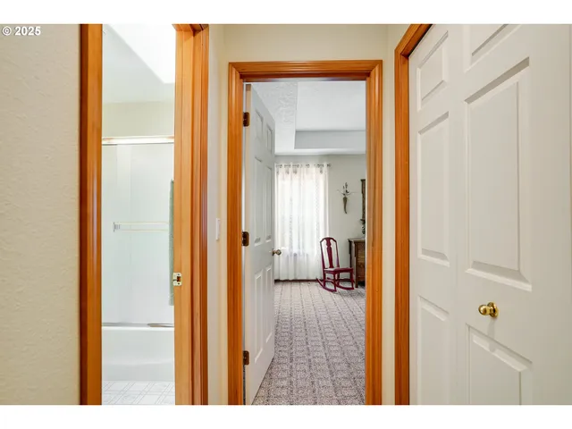 a view of a bathroom from a hallway