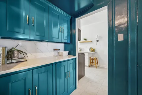 a kitchen with a sink and cabinets