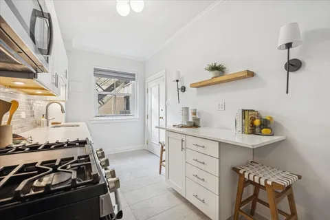 a kitchen with cabinets and appliances