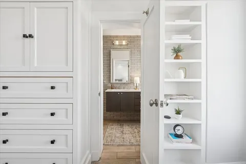 a bathroom with a double vanity sink and a mirror