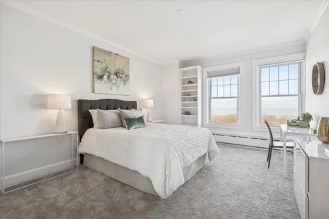 a bed room with a bed and a window