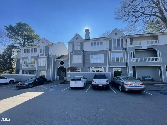 a car parked in front of brick building