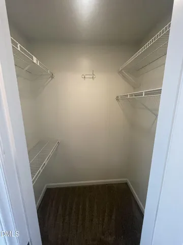 wooden floor in an empty room with a fireplace