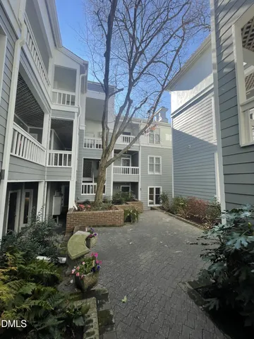 a front view of a building with many windows