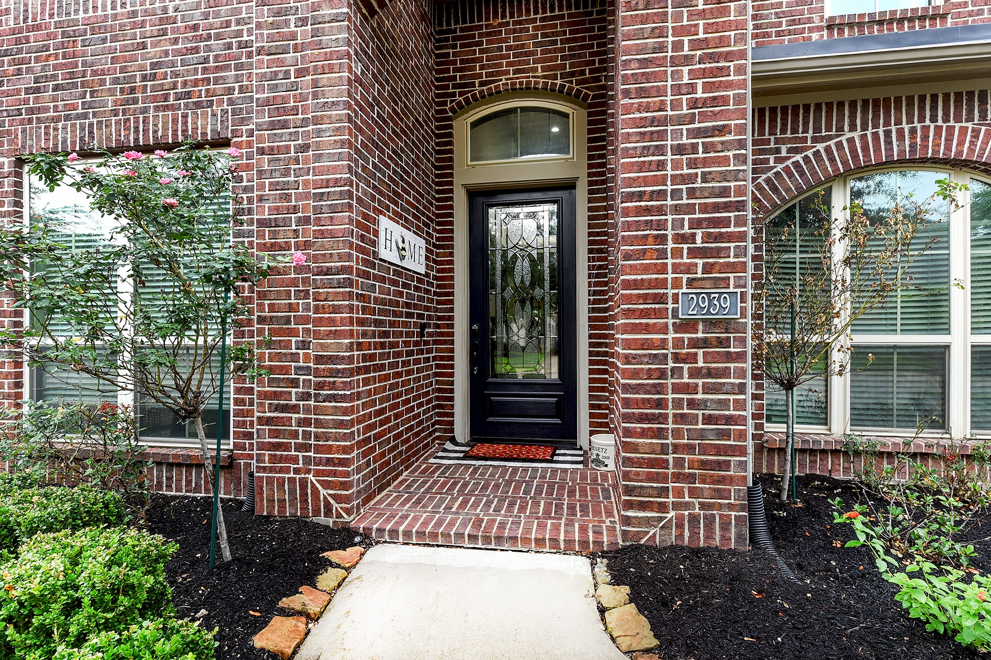 2939 Bobby Jones Road Katy, TX 77494 - Photo 6 of 50 a front view of a house with a garden
