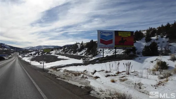 a view of a road with a snow on the road