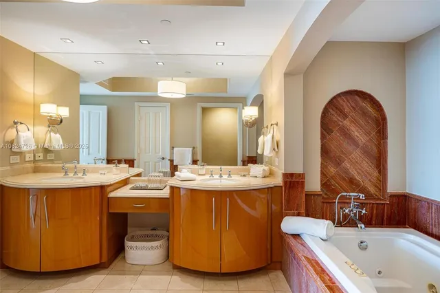 a bathroom with a sink double vanity and shower