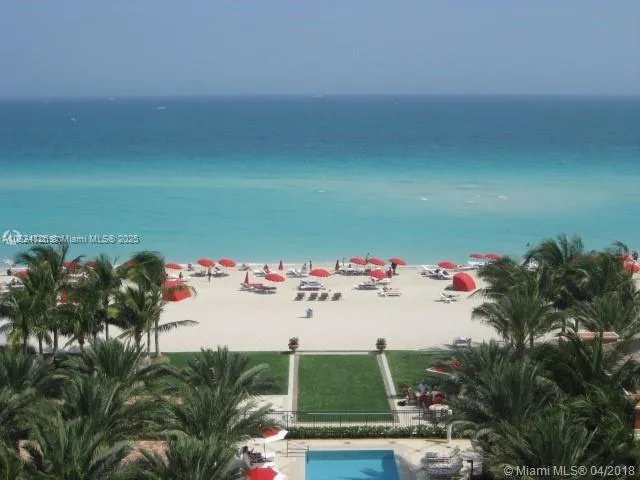 a utility room with lots of clutter and cabinets
