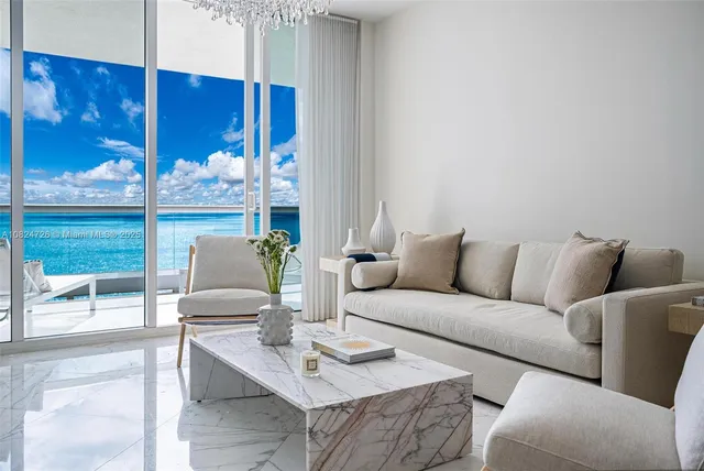 a living room with furniture and a table