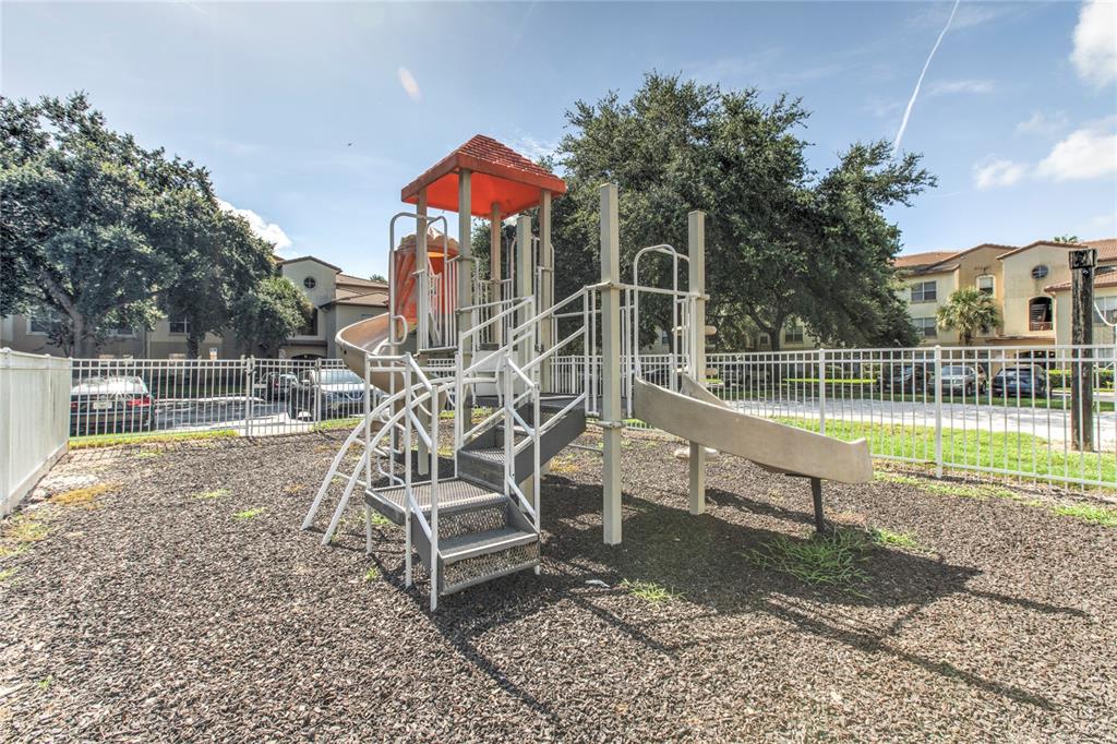823 Camargo Way, Unit 101 Altamonte Springs, FL 32714 - Photo 20 of 20 a view of a chair and table on the garden
