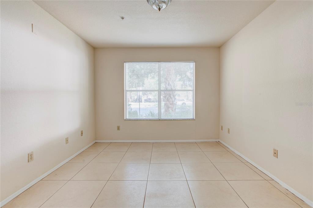 823 Camargo Way, Unit 101 Altamonte Springs, FL 32714 - Photo 9 of 20 an empty room with a window