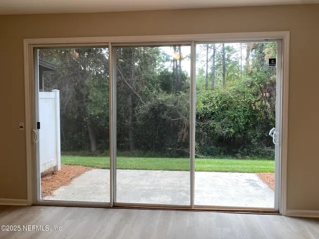 a view of a room with porch and a yard