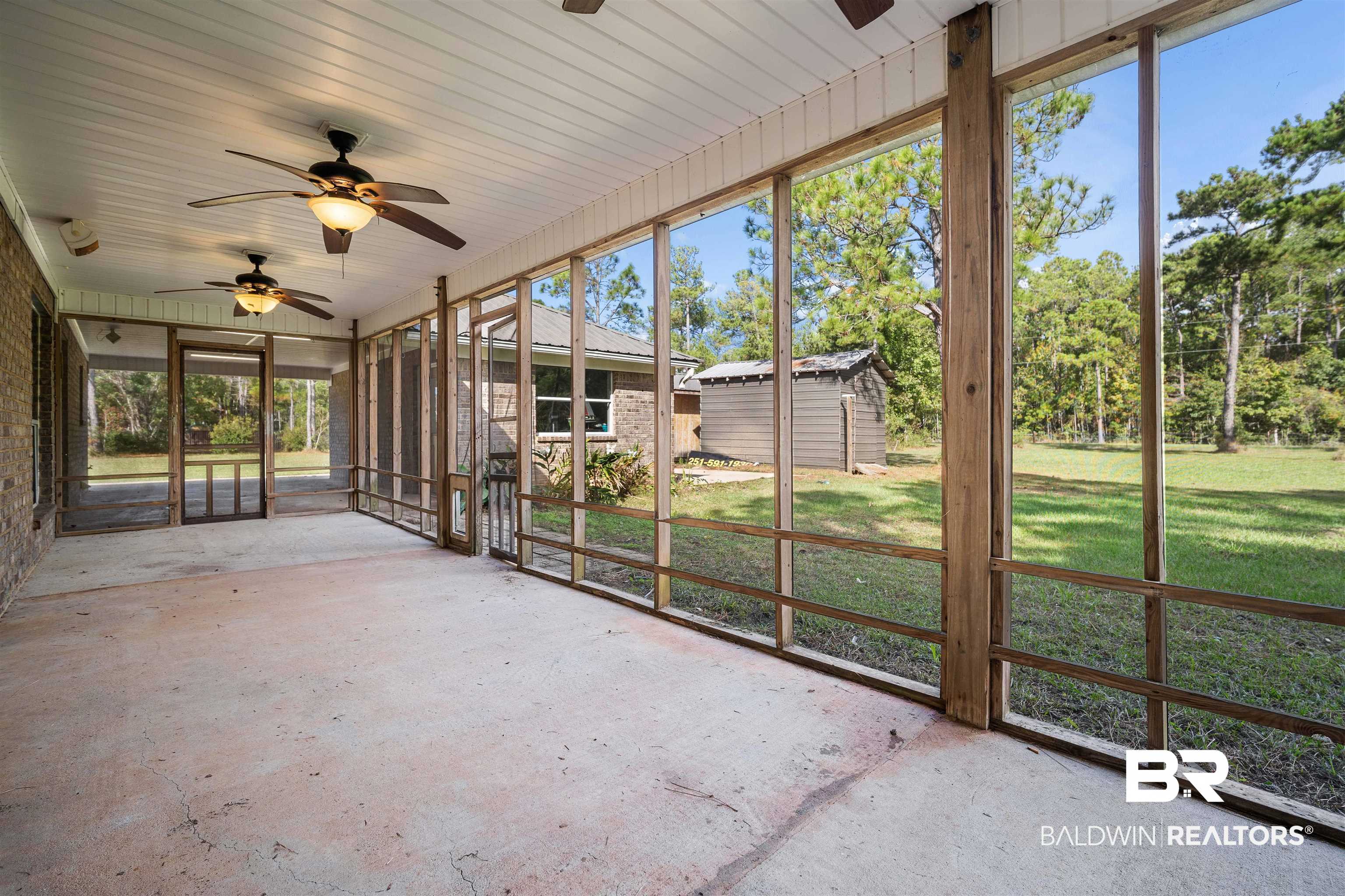 3010 Drag Strip Lane Coden, AL 36523 - Photo 31 of 44 Screened porch with ceiling fan and plenty of natural light
