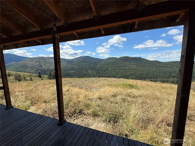 a view of a backyard of the house