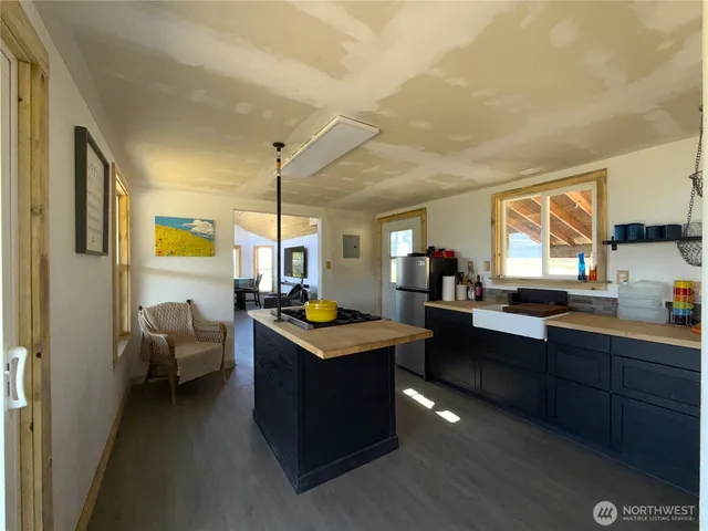 a room with lots of counter space and windows