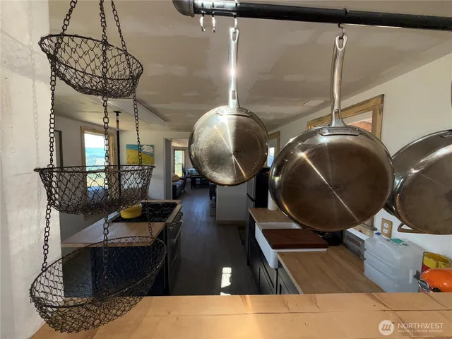 a living room with furniture a flat screen tv and a window