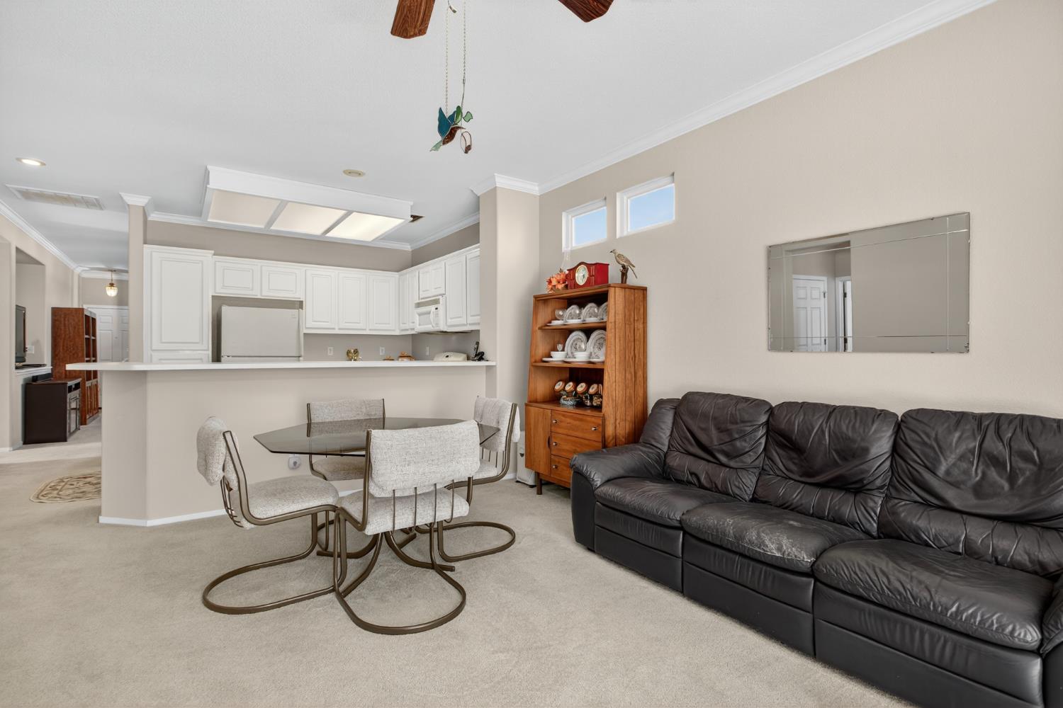 3200 Spring Garden Drive Turlock, CA 95382 - Photo 15 of 30 a living room with furniture a refrigerator and white walls