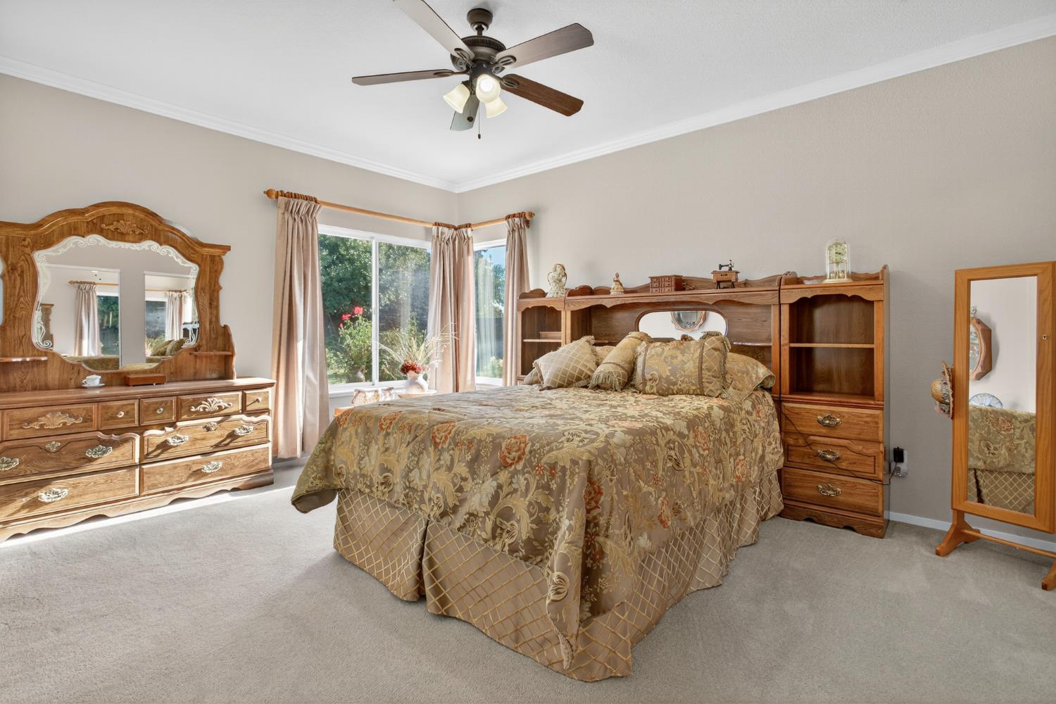 3200 Spring Garden Drive Turlock, CA 95382 - Photo 16 of 30 a spacious bedroom with a bed and a chandelier